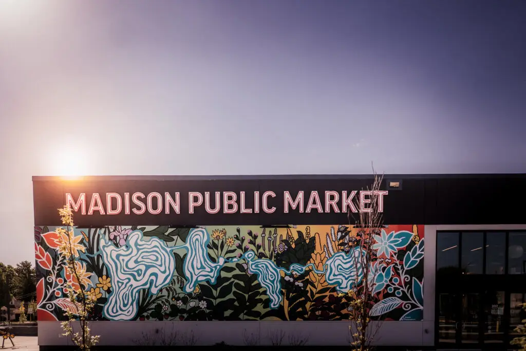 Colorful 'Madison Public Market' mural sign on the building exterior at sunset
