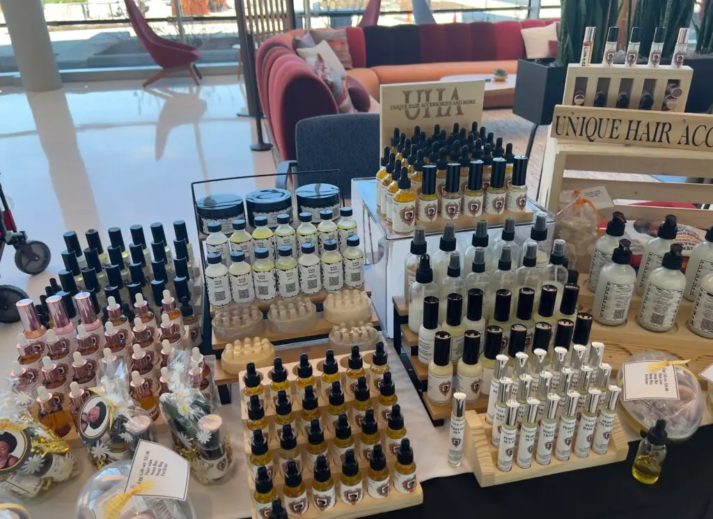 Table display of bottled beverages and beauty products for sale