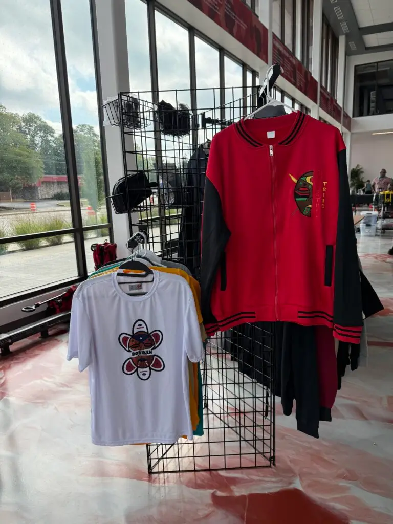 Red apparel displayed on a clothing rack