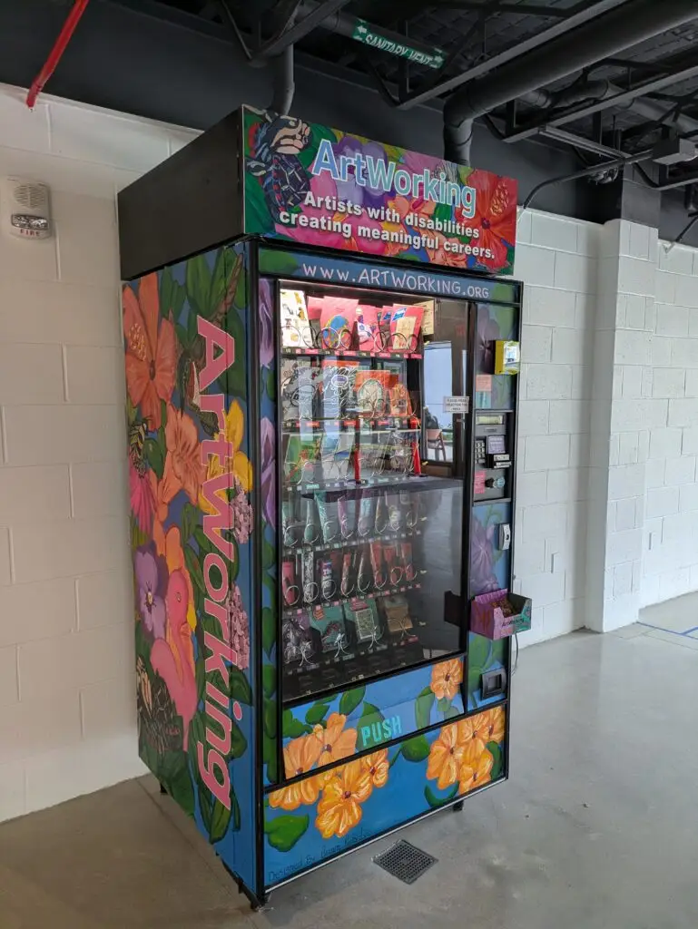 Colorful graffiti-style vending machine inside Madison Public Market