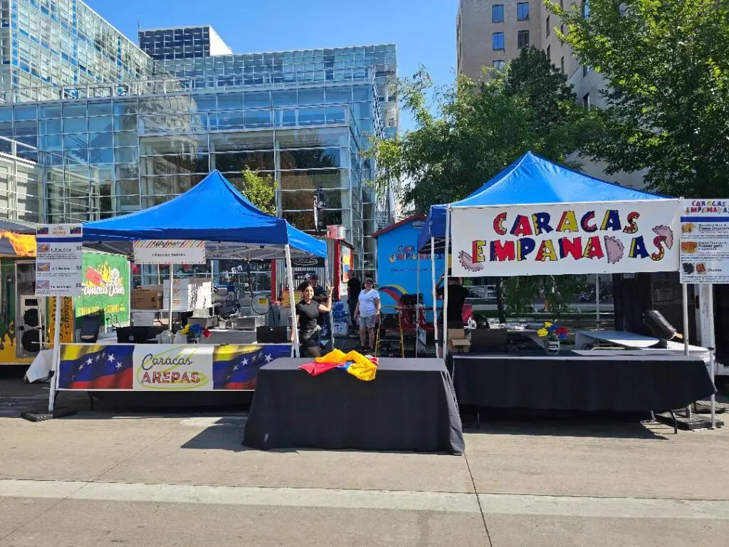 Caracas Empanadas vendor tent set up outdoors at an event